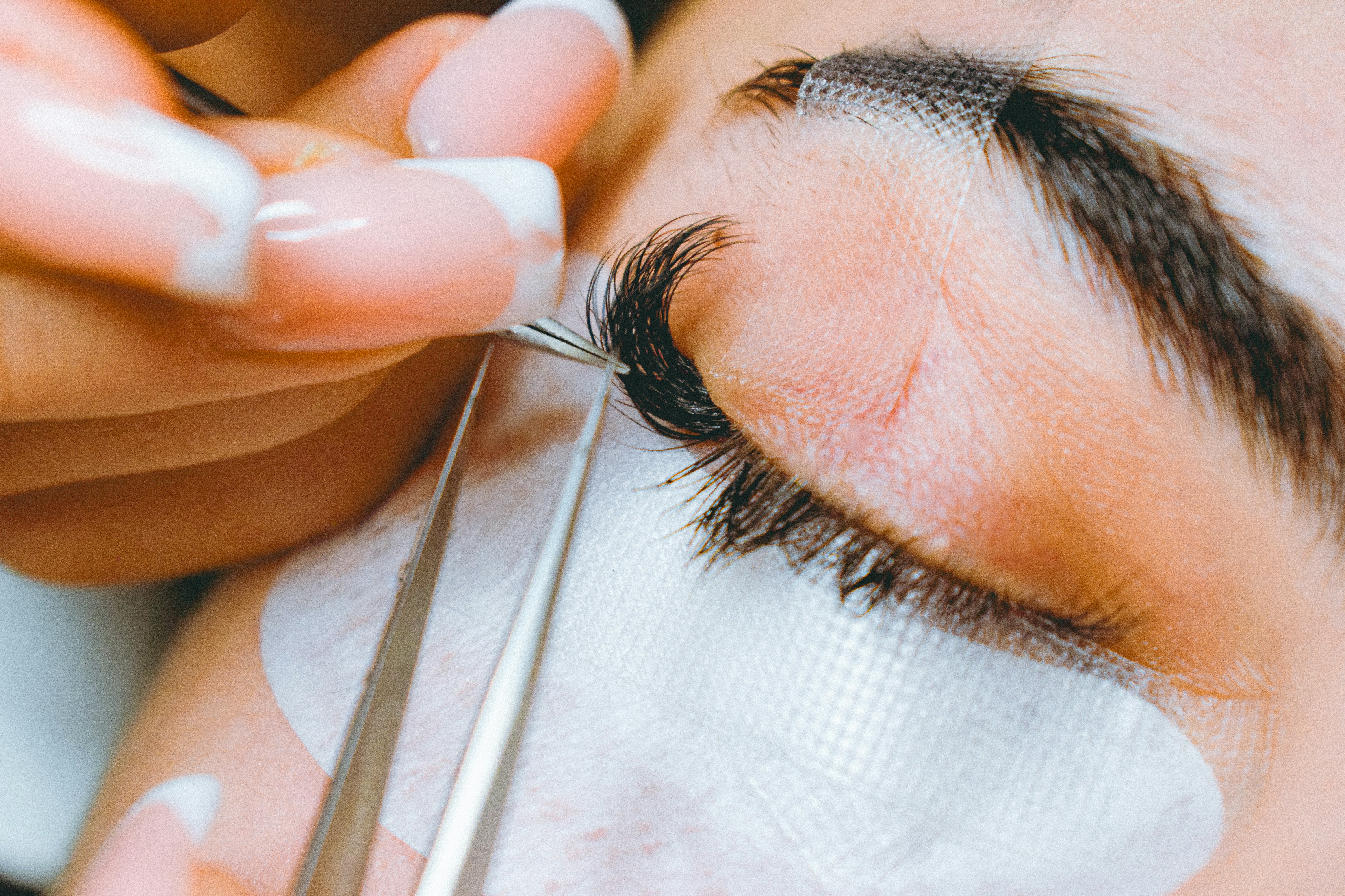 Close-up of professional eyebrow shaping and lash enhancement results